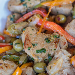 Pan Seared Pork Tenderloin Medallions with peppers, onions and olives