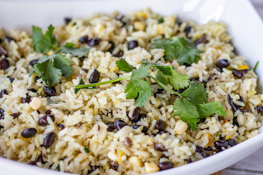 rice with black beans, corn and cilantro in serving dish