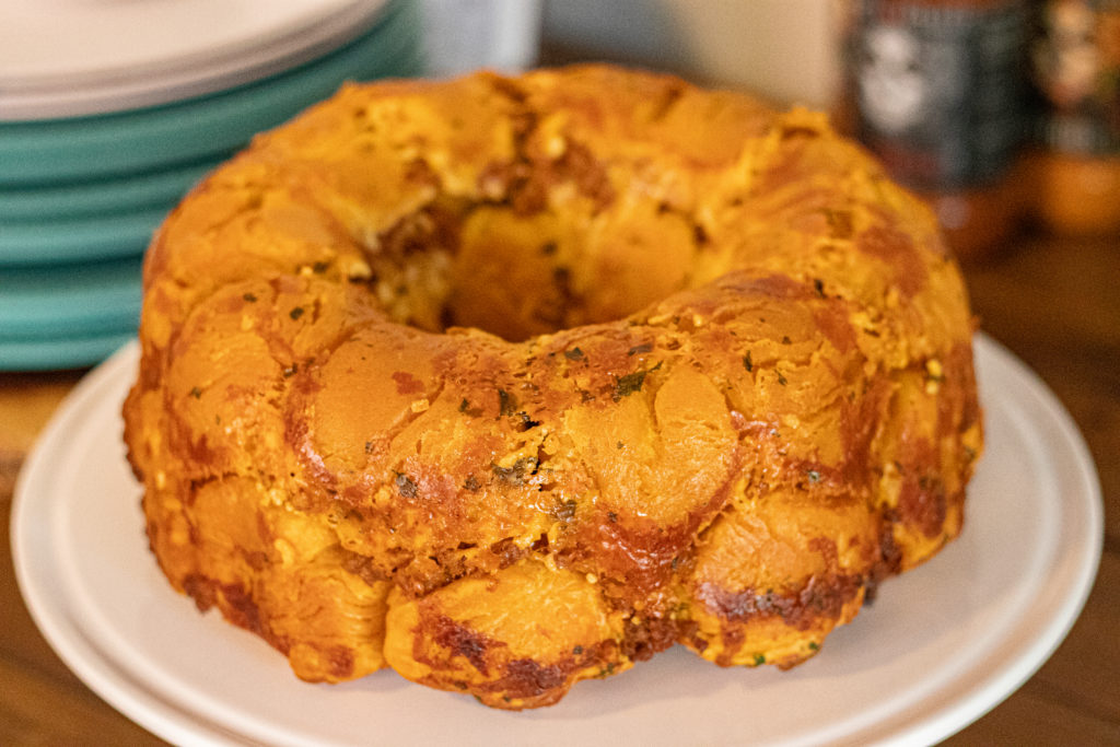 Spicy Chorizo Monkey Bread on top of a cake topper and its still complete.
