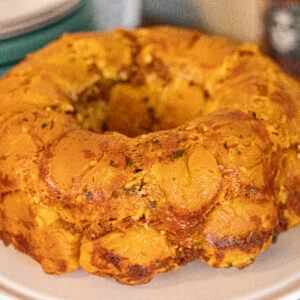 Spicy Chorizo Monkey Bread on top of a cake topper and its still complete.