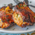 Cheese and Sweet Plantain Stuffed Pork Chops. In this picture you can see 2 stuffed pork chops looking super juicy and shiny. They are brushed with a ginger, soy sauce, honey, garlic glaze. Just delicious!!!