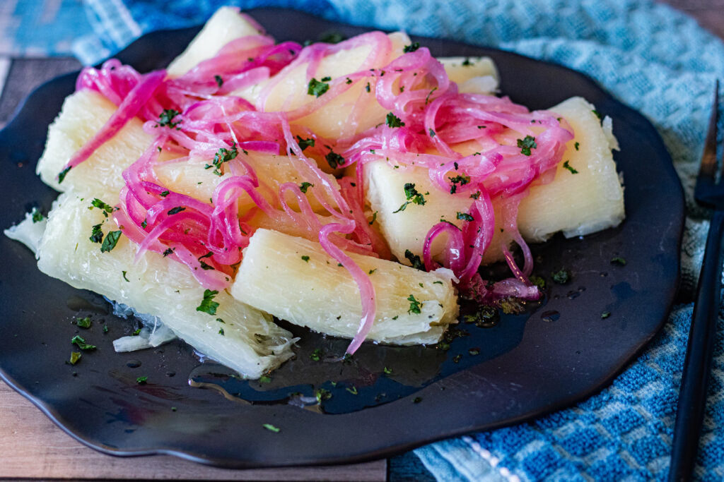 Yuca con Mojo is yuca root, boiled and served with a red onion relish that is very traditional in Caribbean islands like Dominican Republic, Cuba and Puerto Rico.