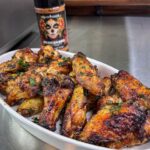 Honey Mexican BBQ wings in a serving dish topped with chopped cilantro