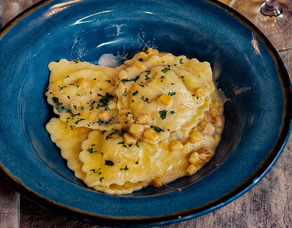 20 minute creamy corn sausage ravioli in a serving plate for one person.